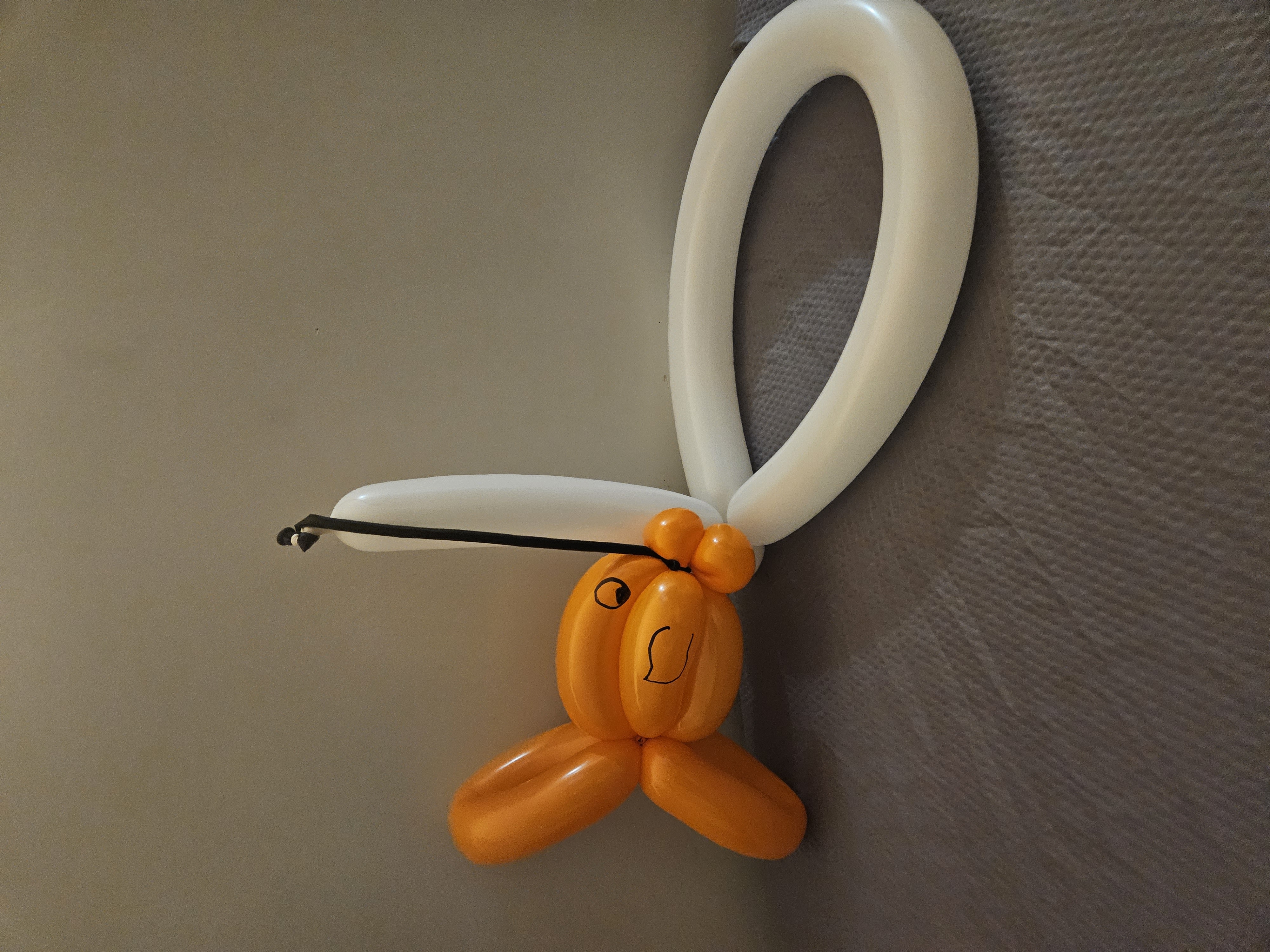 white and orange balloon fishing hat