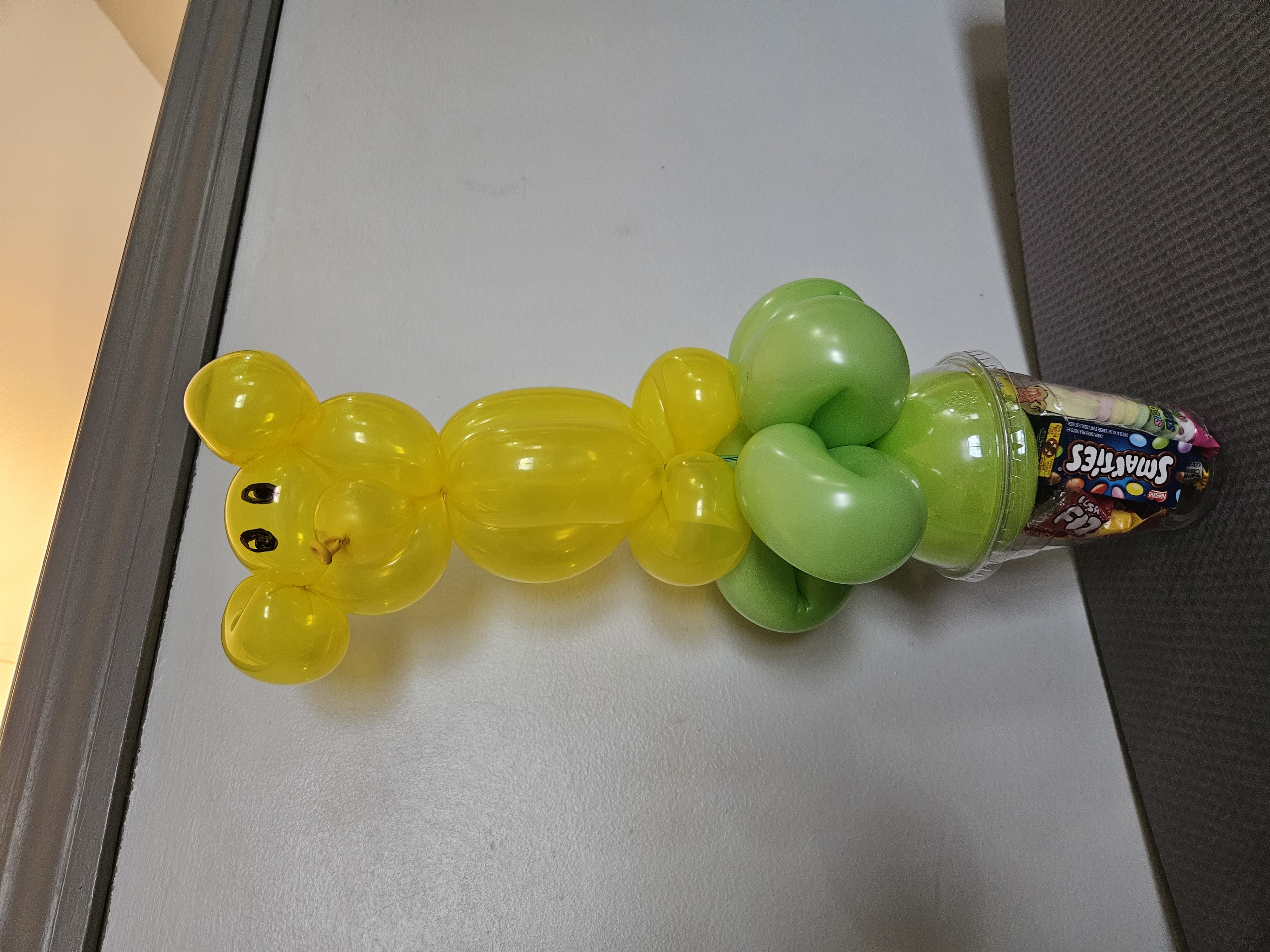gold balloon teddy bear on a candy cup