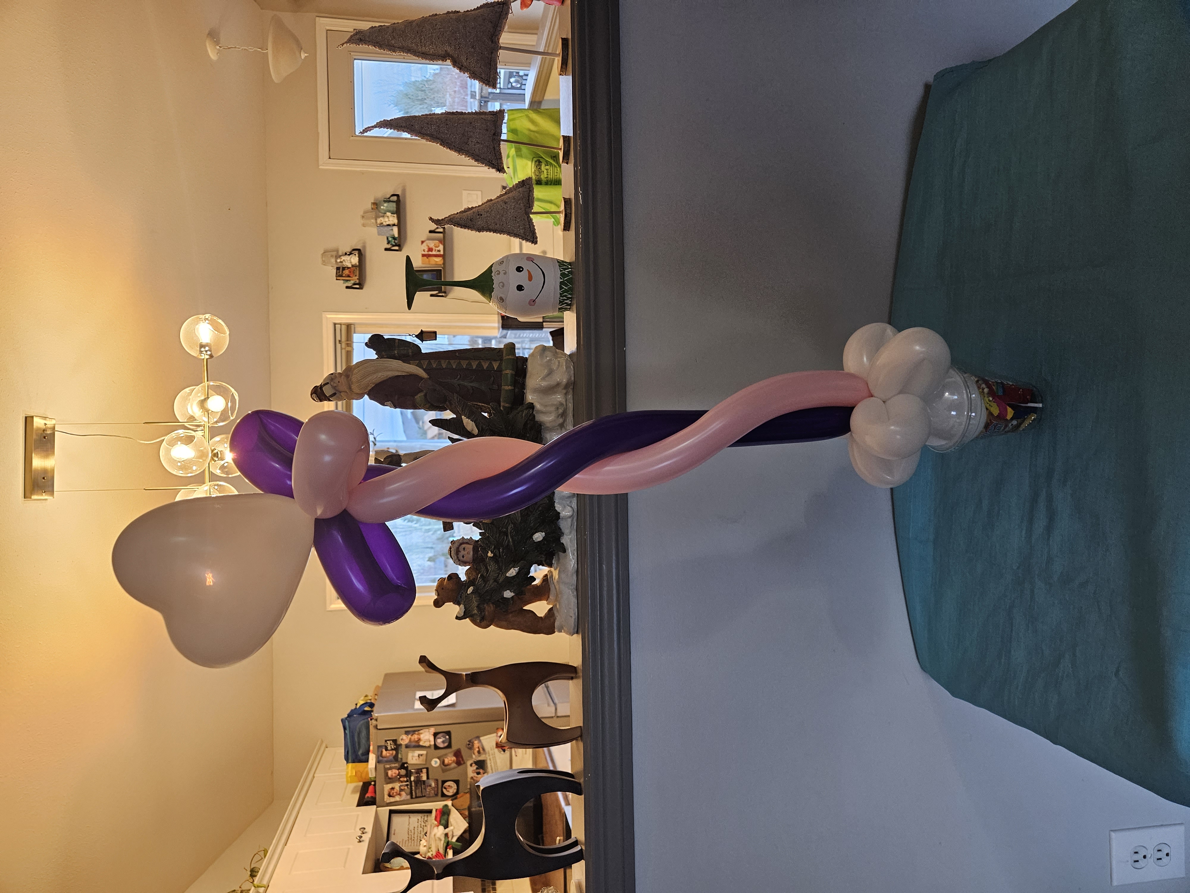 pink heart cane balloon on a candy cup