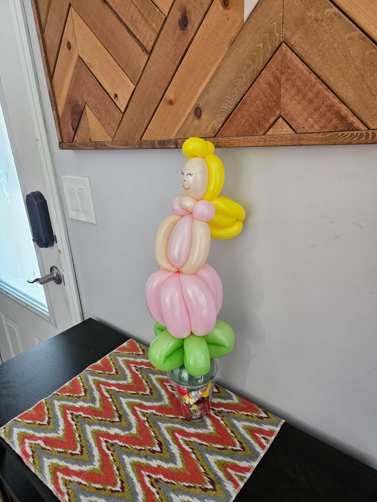 Balloon princess on a candy cup