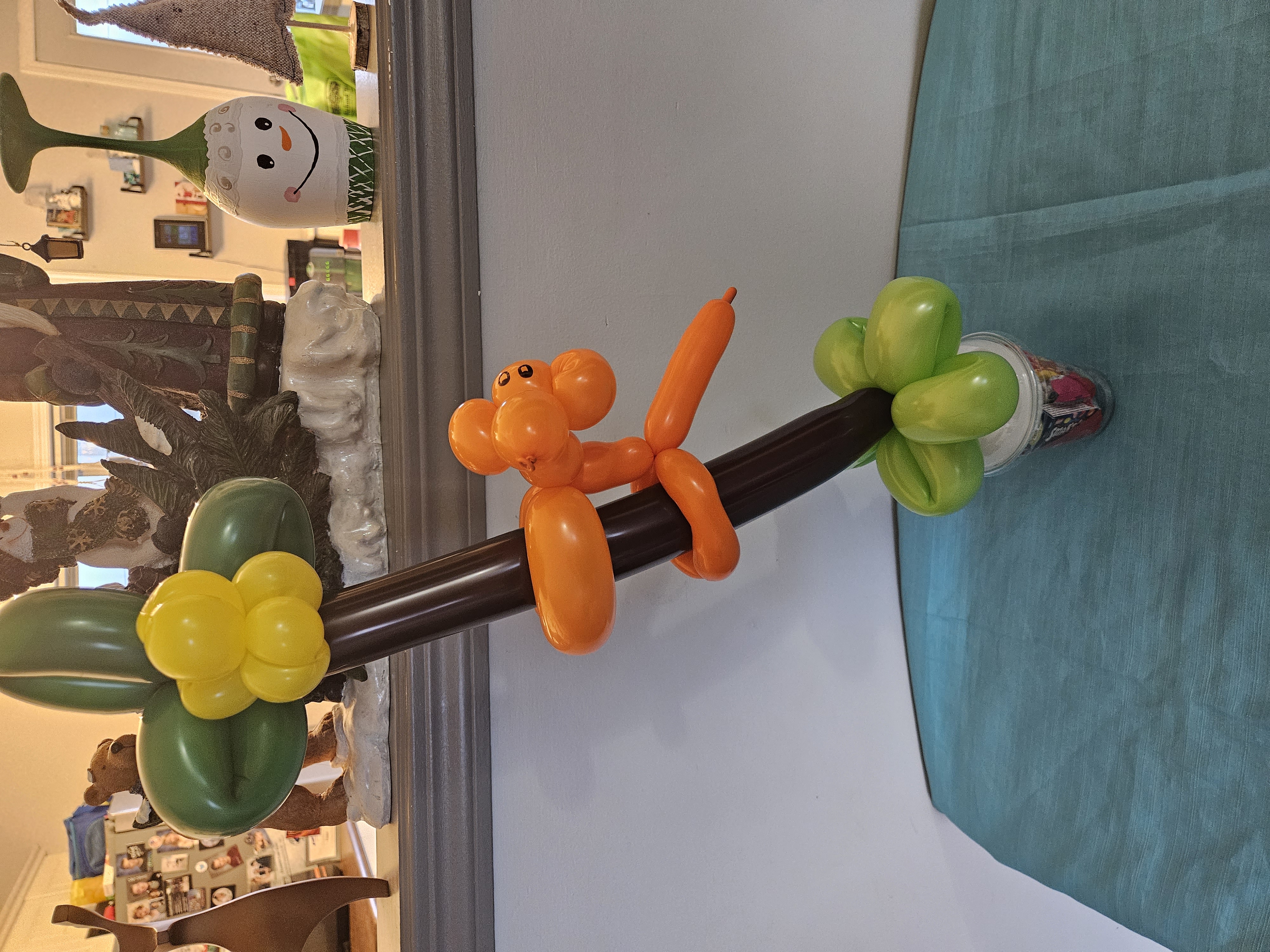balloon monkey and banana tree on a candy cup